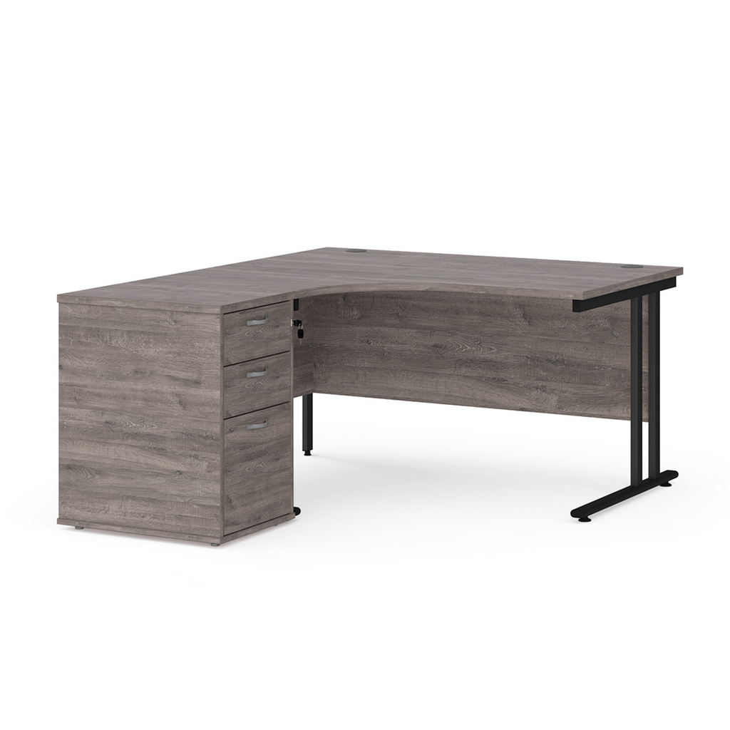 Picture of Maestro 25 left hand ergonomic desk 1400mm with black cantilever frame and desk high pedestal - grey oak