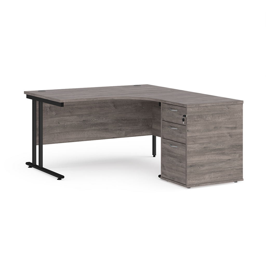 Picture of Maestro 25 right hand ergonomic desk 1400mm with black cantilever frame and desk high pedestal - grey oak