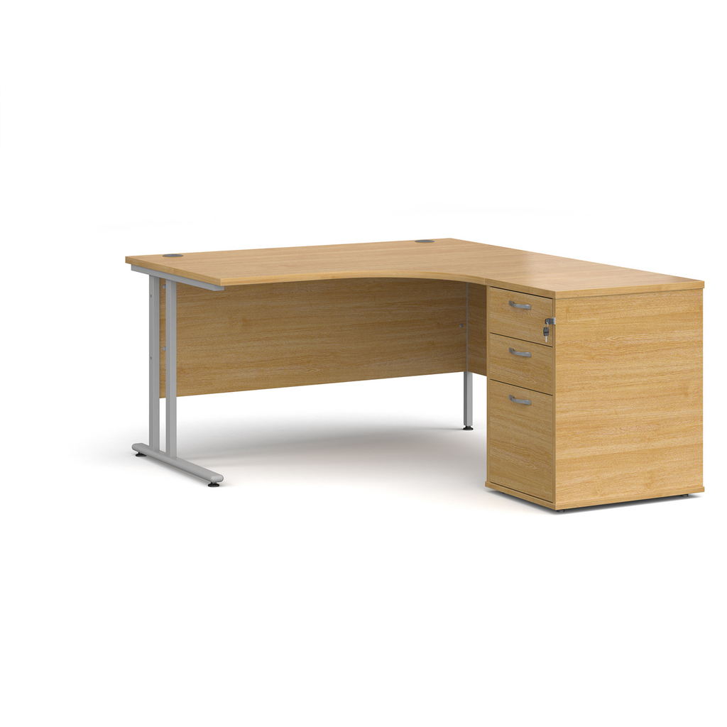 Picture of Maestro 25 right hand ergonomic desk 1400mm with silver cantilever frame and desk high pedestal - oak