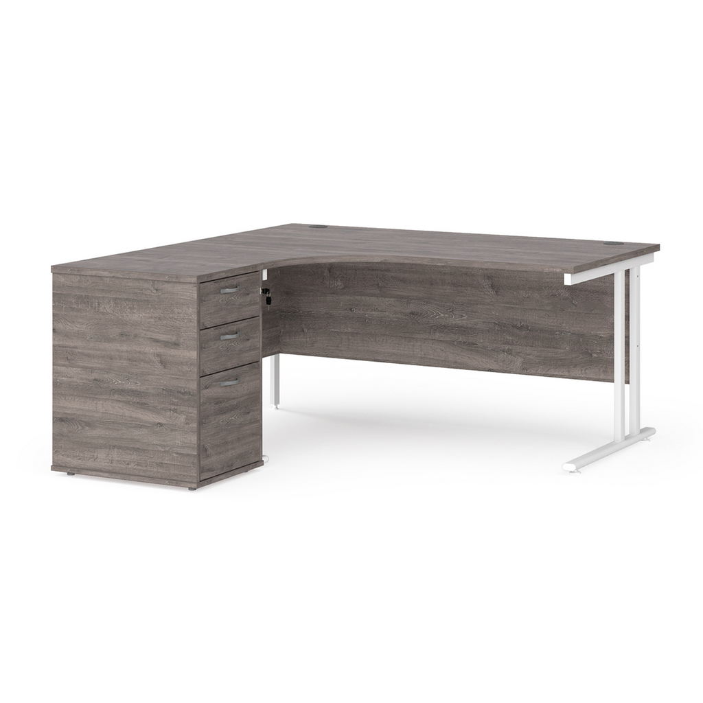 Picture of Maestro 25 left hand ergonomic desk 1600mm with white cantilever frame and desk high pedestal - grey oak