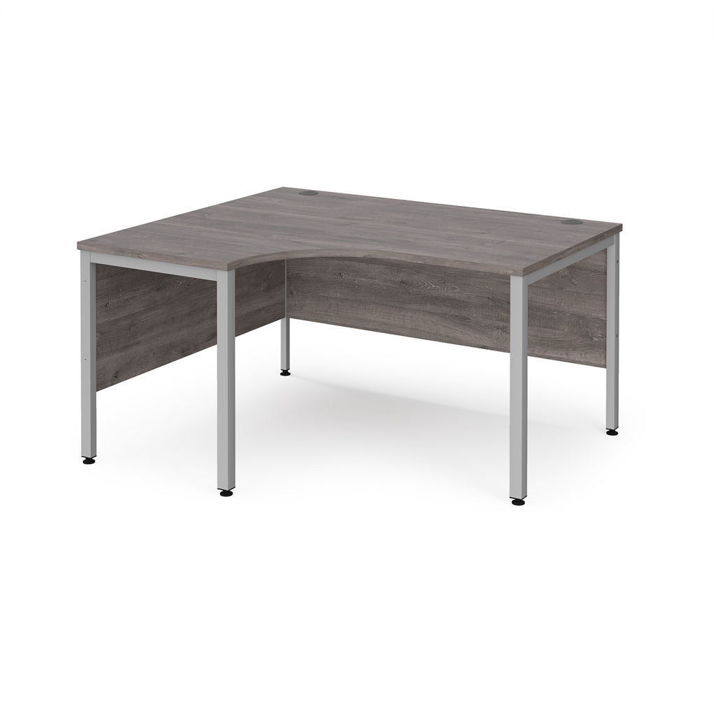 Picture of Maestro 25 left hand ergonomic desk 1400mm wide - silver bench leg frame, grey oak top