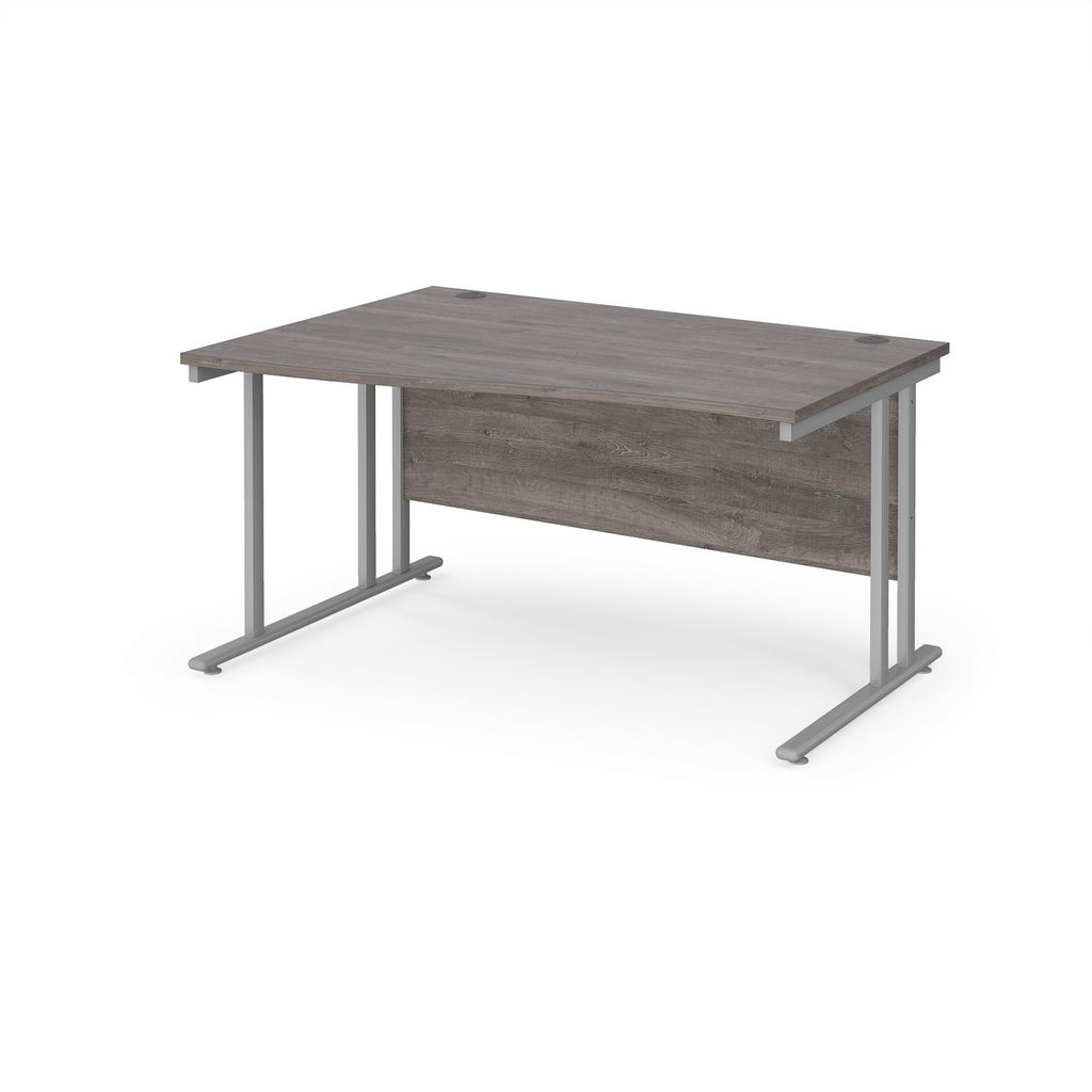 Picture of Maestro 25 left hand wave desk 1400mm wide - silver cantilever leg frame, grey oak top