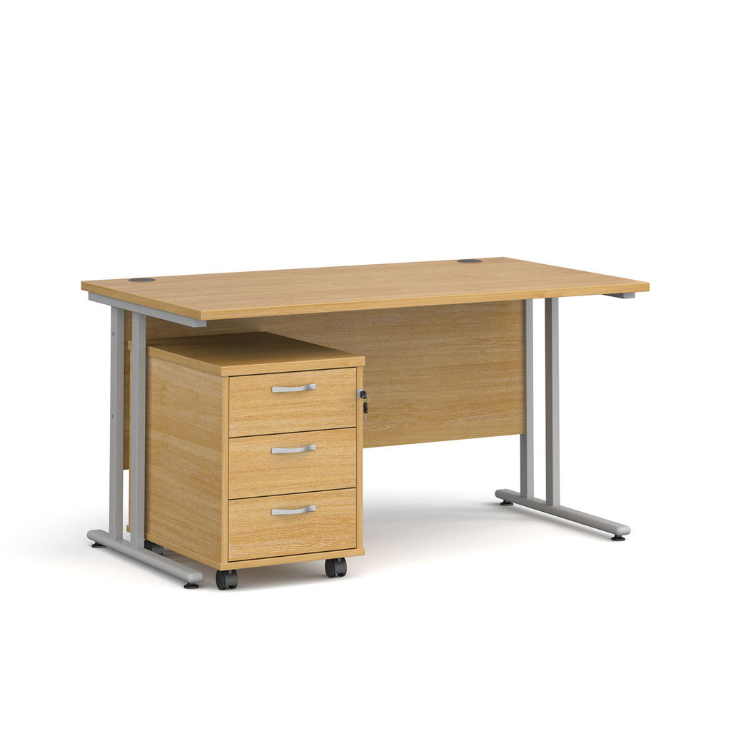 Picture of Maestro 25 straight desk 1400mm x 800mm with silver cantilever frame and 3 drawer pedestal - oak
