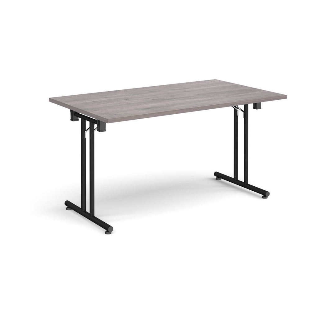 Picture of Rectangular folding leg table with black legs and straight foot rails 1400mm x 800mm - grey oak